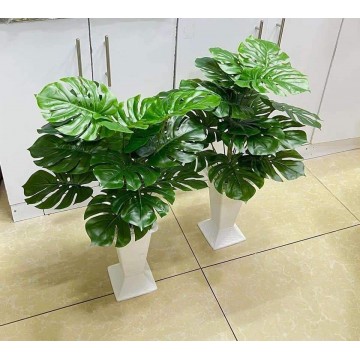 Artificial plant and vase